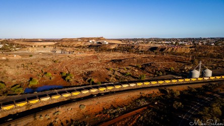 Huge ore train (off to a processing plant?) at the Line of Lode with Broken Hill city in the background. [0956]
