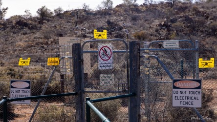 The entrance gate to the John Simons Flora & Fauna Sanctuary, containing the Cultural Walk Trail, warns of electrical fences. [2705]