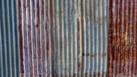 Colorfull corrgugated steel fence seen in Broken Hill. [3150]