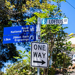 Signpost in Bundeena pointing to the beach walk to the Jibbon Rock Engravings. [6464]