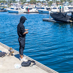 A fisherman hoping to catch dinner off the wharf at Cronulla. [6408]