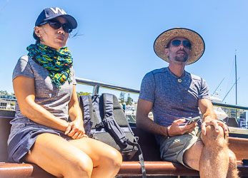 Two passengers enjoying the sunshine on the Curranulla ferry ride. [6426]