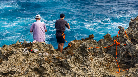 Those limestone pinnacles are razor sharp, and these fishermen, one tethered, would not want to be dragged across them.[9895]