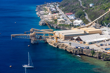 The phosphate terminal at the Port on Flying Fish Cove, showing an inbound conveyor and the steep twisty road from the island's high plateau. [0077]