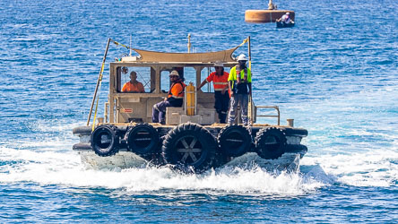 A working boat of the Port of Christmas Island making its way to the general cargo jetty. [9875]