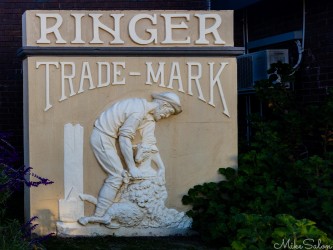 Cement panel from the original 1899 Ringer Store which survived to 1971 when it was demolished to build a very ordinary looking motel. A ringer was the top gun in a shearing shed. This artwork is the best thing about the site. [5043]
