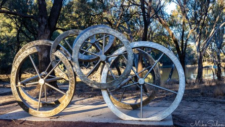 Cobb`s Wheels by John Wooller is a celebration of the importance of Cobb and Co to the history of Hay. Note the broken and bogged wheels! [5038]