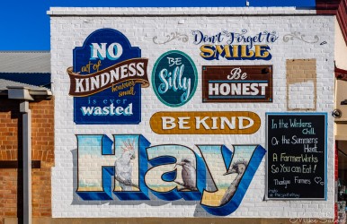 Encouraging mural on a shop wall in Hay. 'A Farmer Works So You Can Eat`. [4995]