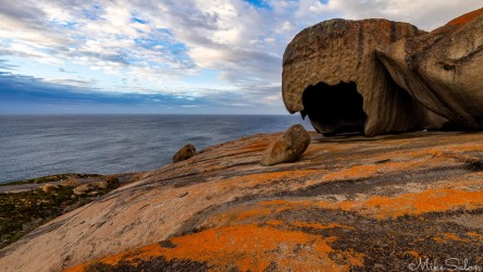 Orange lichen colours this part of the Remarkables` granite dome. [4100]