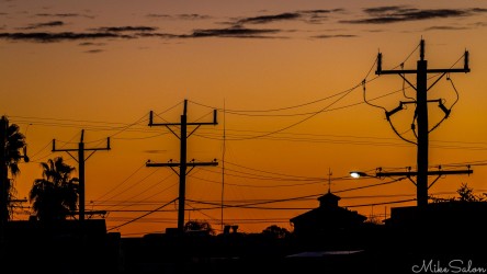 Mildura’s evening skyline — a tangle of wires silhouetted against the sunset, connecting everything and nothing at once. [4923]