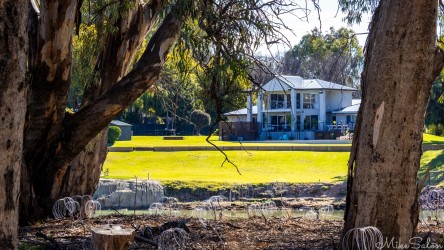 Looking from Mildura`s Field of Lights across the Murray to a riverside house in NSW. A quiet symbol of the town’s prosperity, where the river becomes both view and lifestyle. [4798]