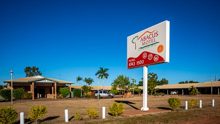 Under brilliant blue skies, the Abacus Motel welcomes guests on the outskirts of Mt Isa. [1119]