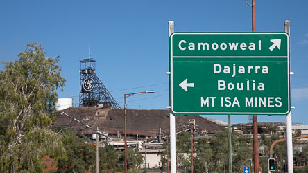 Directional signpost in Mt Isa pointing to the nearest towns, and the famed Mines. [0815]
