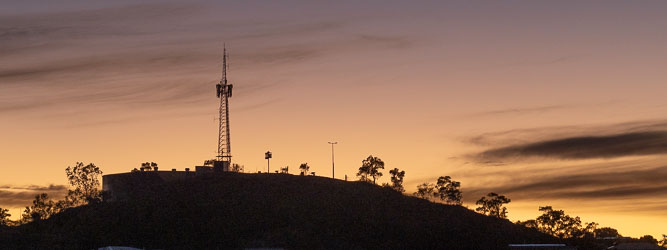 Dawn's first light from behind Mt Isa Lookout. [6625]