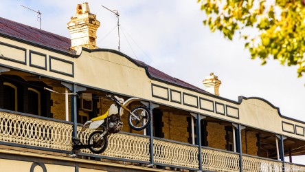 Overhanging Main Street Peterborough, a motor-bike mounted on the first floor of an old pub, defying both gravity and convention. [3185]