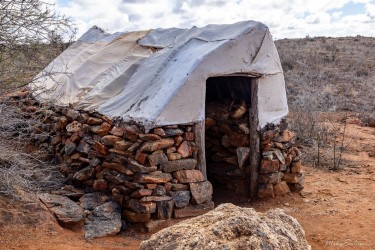 Built from stone and tin, this hut offered shelter from the harsh outback — simple, sturdy, and enduring. The original would have been covered with hessian. [2972]