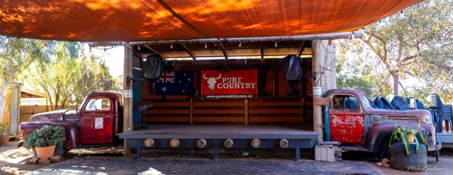 Pity we weren`t there when a gig was on. Music and laughter echo here — a rustic outdoor stage framed by old trucks and the spirit of country hospitality. [3003]