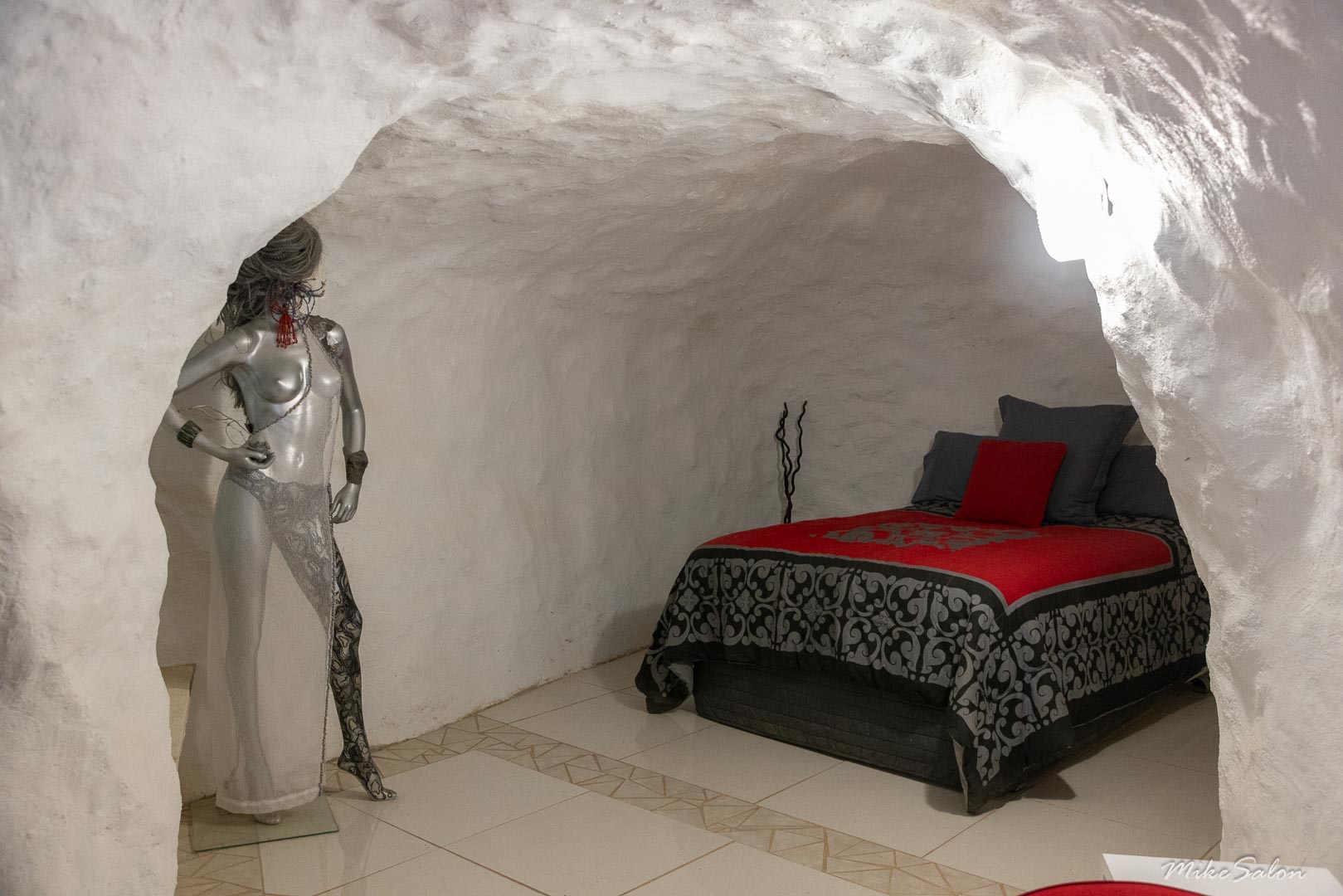 One of several underground bedrooms in the White House of White Cliffs, decorated by an impressive mannequin. [2085]