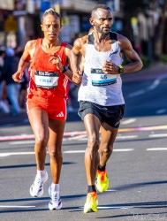 Ethiopian runner Workenesh Edesa Gurmesa runs alongside David Wanjohi through Taylor Square during the 2025 Sydney Marathon. Edesa finished 3rd among 5,934 women, while Wanjohi reached the 40 km mark before withdrawing, I think. Their determined stride captures the intensity of elite competition in the morning light. [5388]